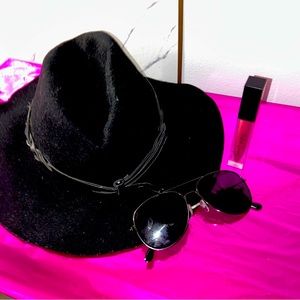 Fedora all black hat, with a creamy matte lipstick With some black shades!